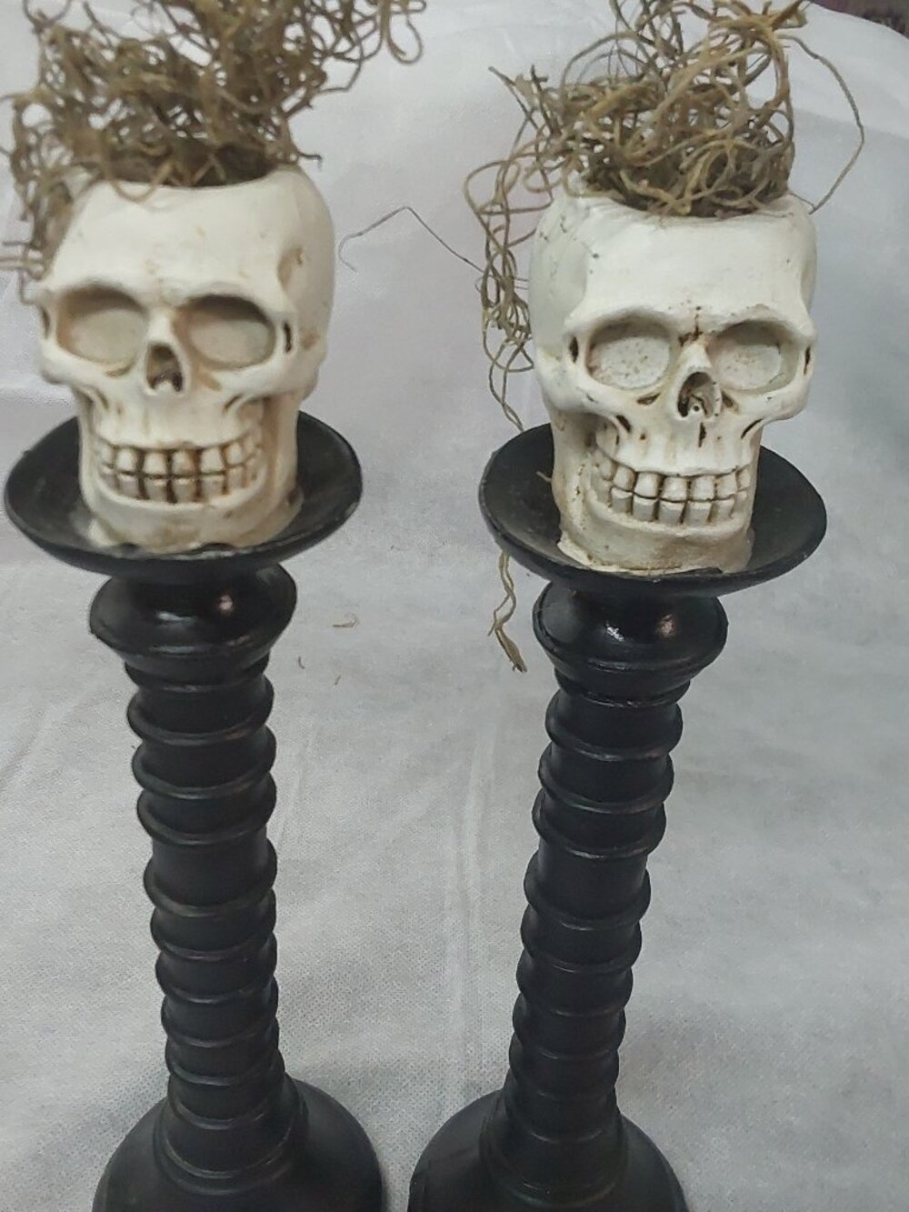 Pair of resin skull candlesticks